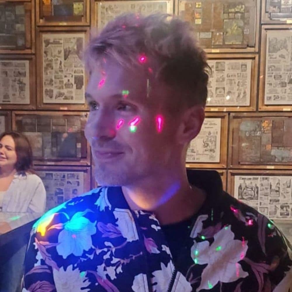 Brian Vaughn under colored stage lights
